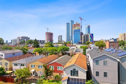 a aerial view of a city with tall buildings