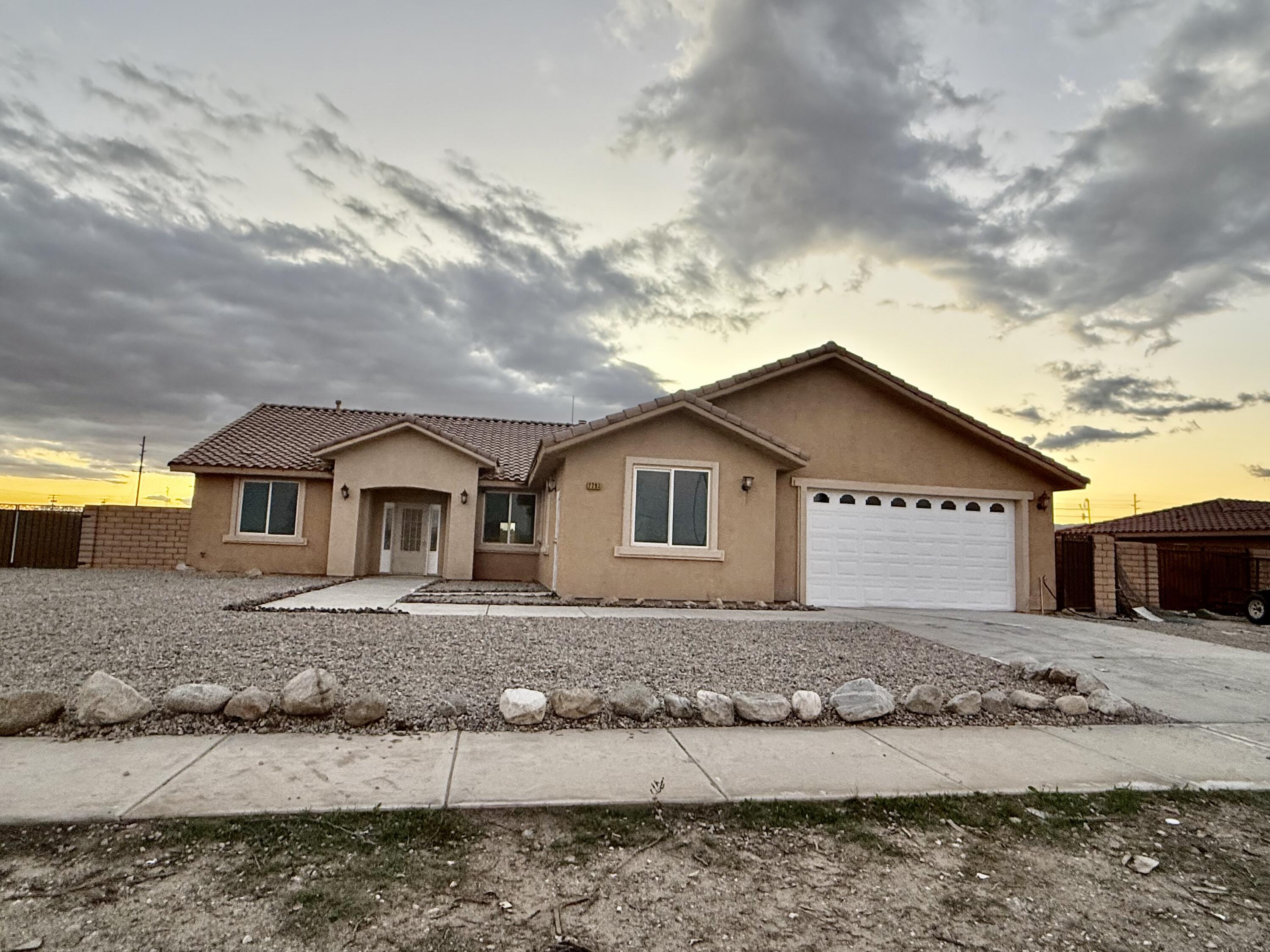 2283 Azure Avenue Thermal, CA 92274 - Photo 2 of 26 a front view of a house with a yard