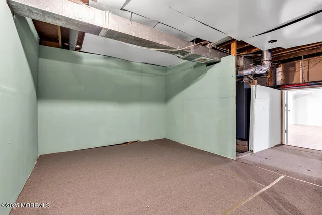 a view of a room with wooden walls