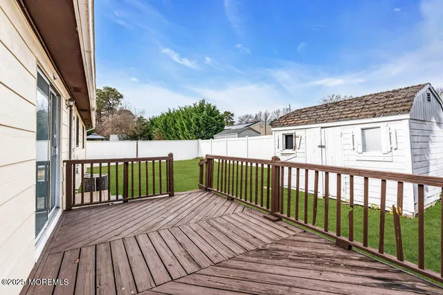 a balcony with wooden floor