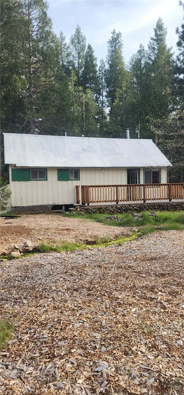 7515 Abner Lane Forest Ranch, CA 95942 - Photo 23 of 65 a house with a garden covered with wooden fence