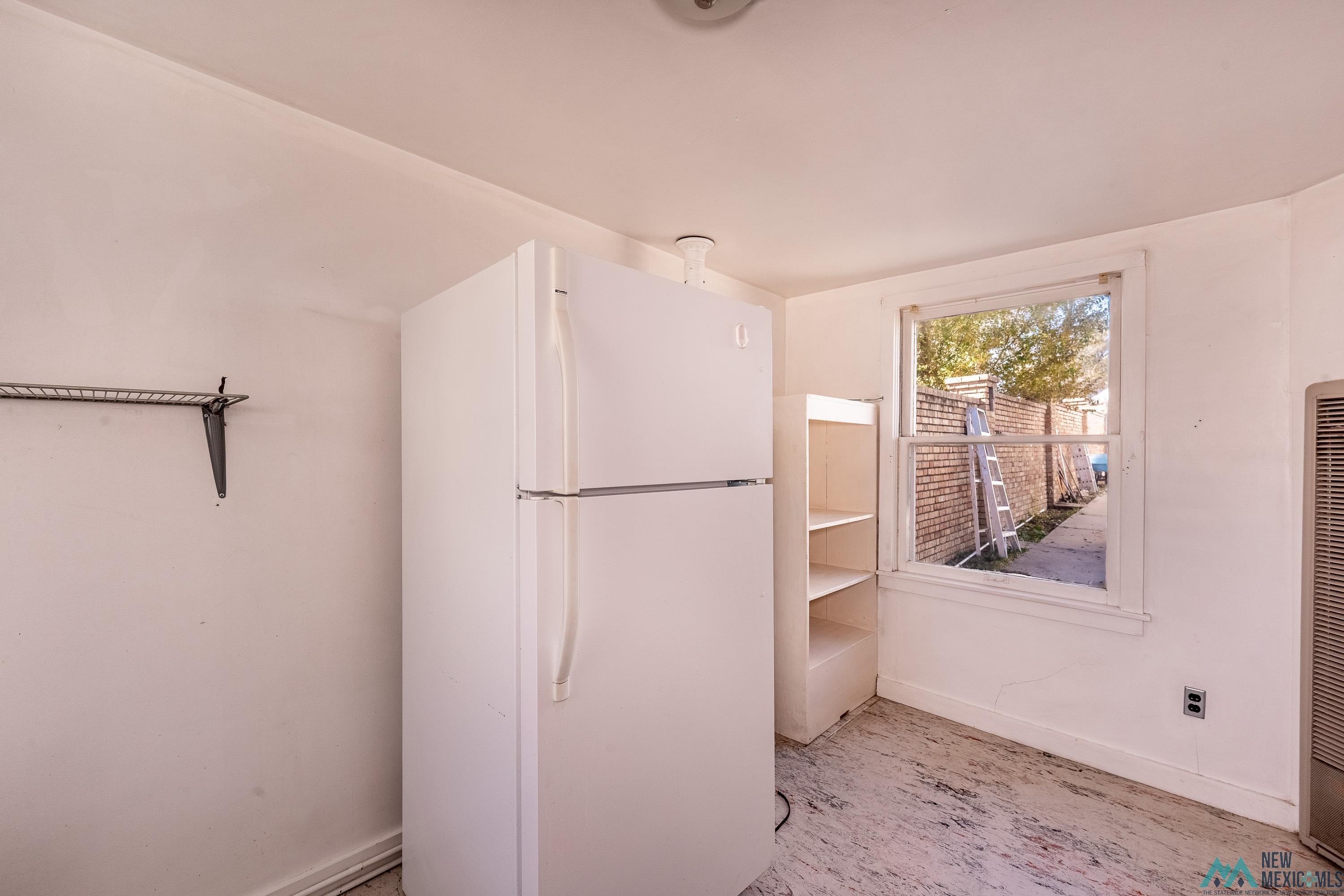 301 South 4th Street Raton, NM 87740 - Photo 67 of 78 Kitchen featuring freestanding refrigerator and a heating unit