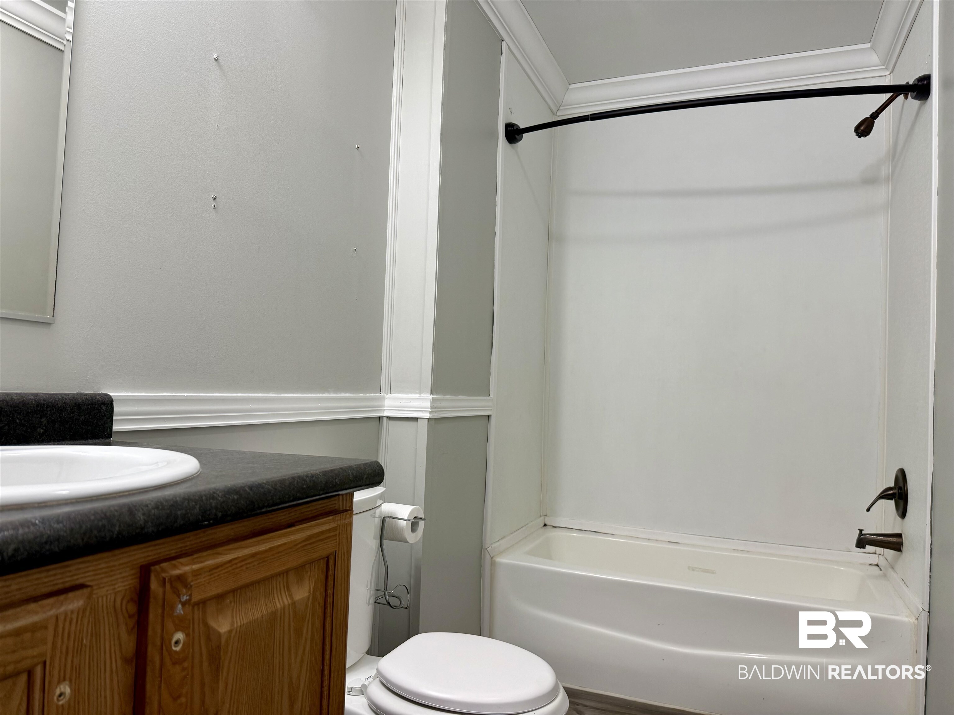 1064 Old Fannie Road Flomaton, AL 36441 - Photo 12 of 17 Bathroom featuring vanity, shower / bath combination, and crown molding