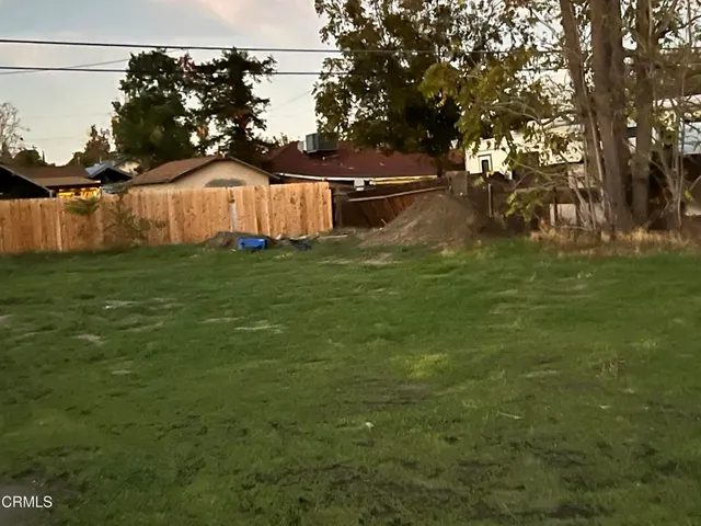 a view of outdoor space with garden and trees