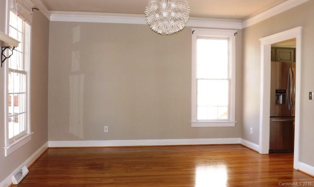 537 Glen Walk Drive Fort Mill, SC 29708 - Photo 2 of 19 an empty room with wooden floor fan and windows