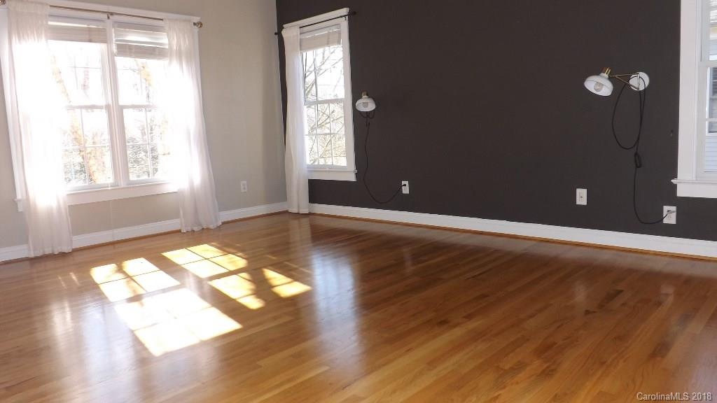 537 Glen Walk Drive Fort Mill, SC 29708 - Photo 12 of 19 an empty room with wooden floor and windows