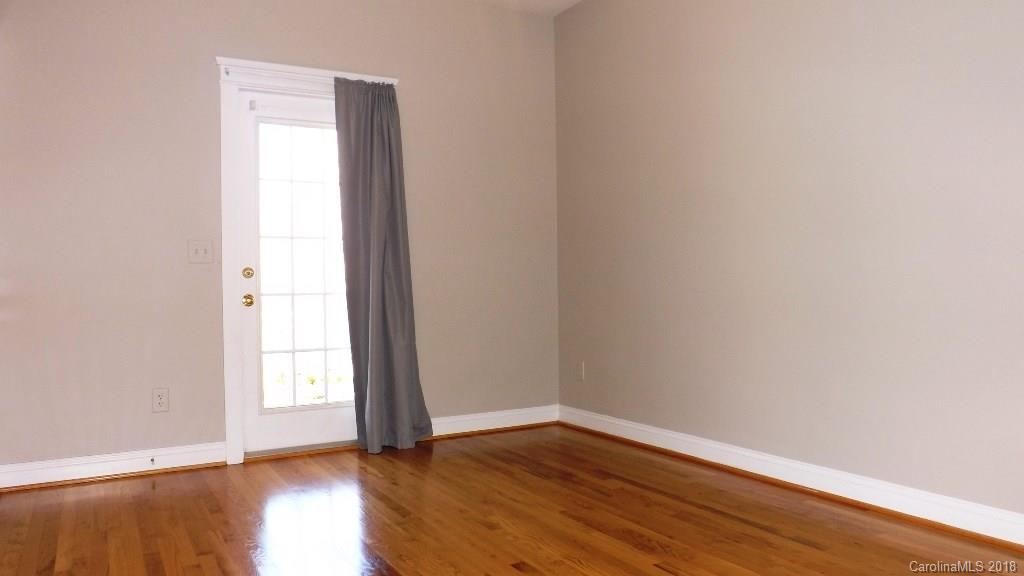 537 Glen Walk Drive Fort Mill, SC 29708 - Photo 13 of 19 an empty room with wooden floor and windows