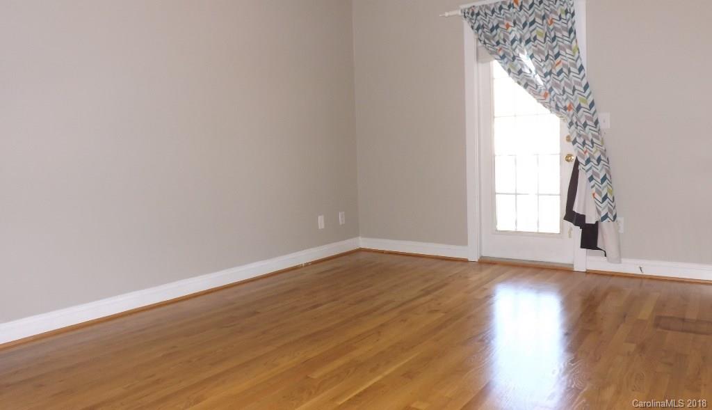 537 Glen Walk Drive Fort Mill, SC 29708 - Photo 15 of 19 a view of an empty room and wooden floor and window