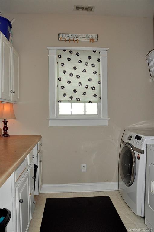 537 Glen Walk Drive Fort Mill, SC 29708 - Photo 16 of 19 a utility room with cabinets washer and dryer