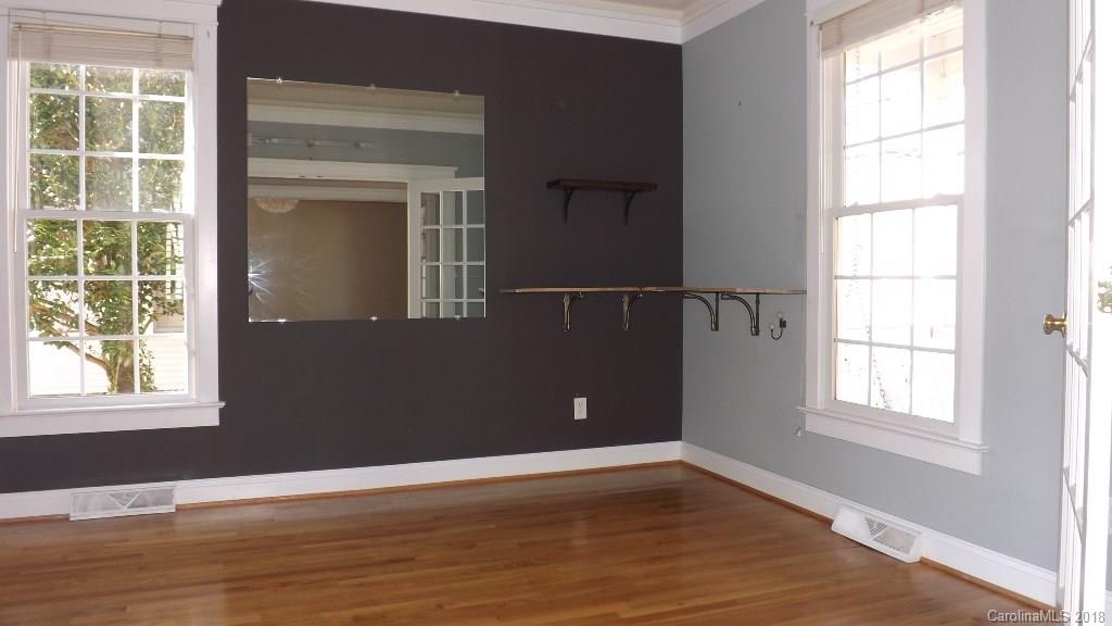 537 Glen Walk Drive Fort Mill, SC 29708 - Photo 3 of 19 an empty room with wooden floor and windows