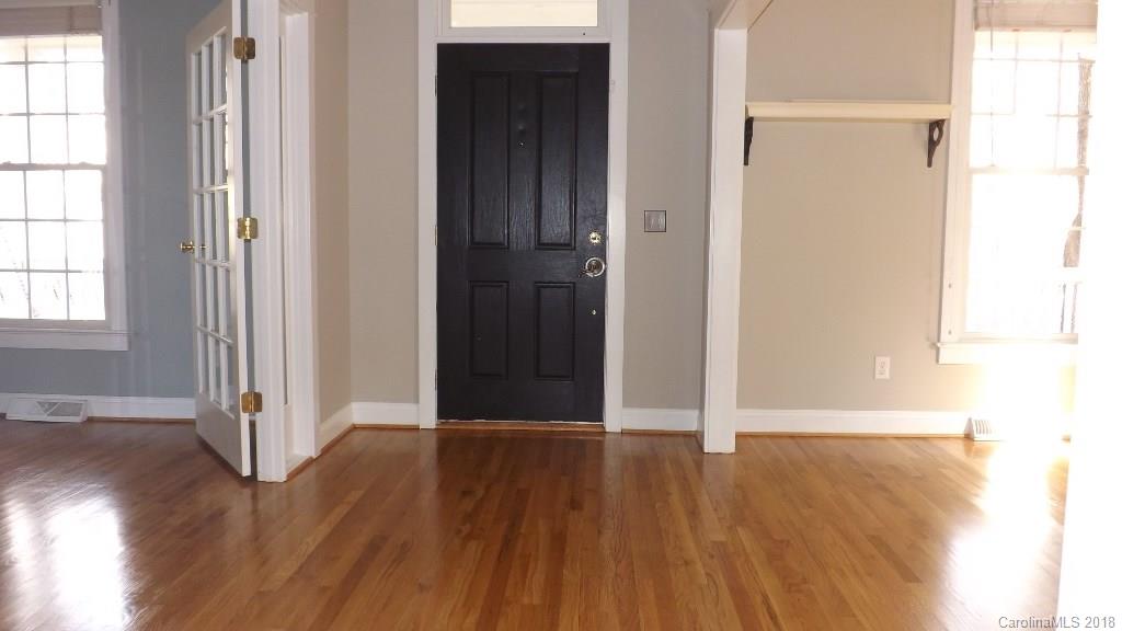 537 Glen Walk Drive Fort Mill, SC 29708 - Photo 4 of 19 an empty room with wooden floor and windows