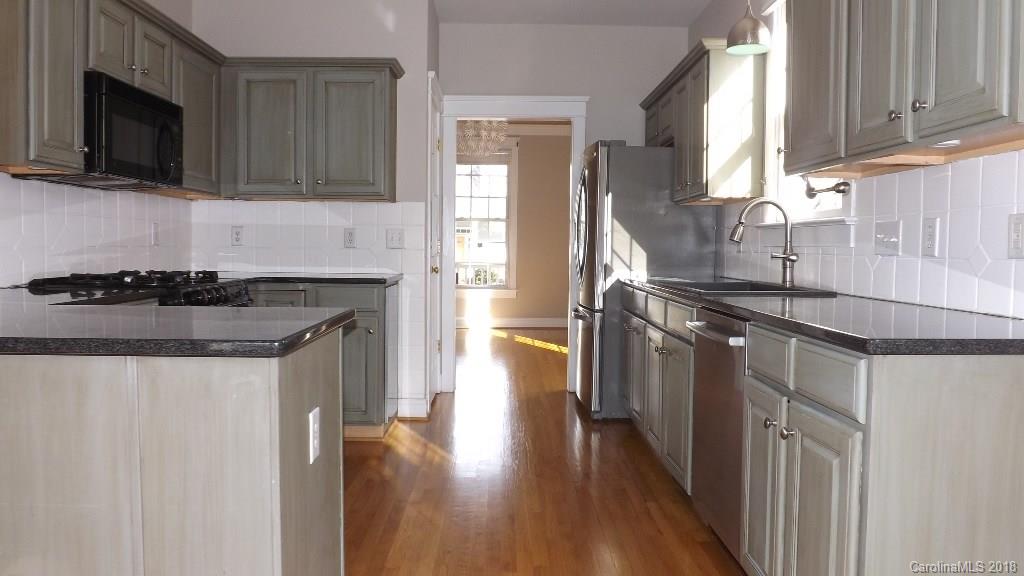 537 Glen Walk Drive Fort Mill, SC 29708 - Photo 5 of 19 a kitchen with stainless steel appliances granite countertop a sink stove and microwave