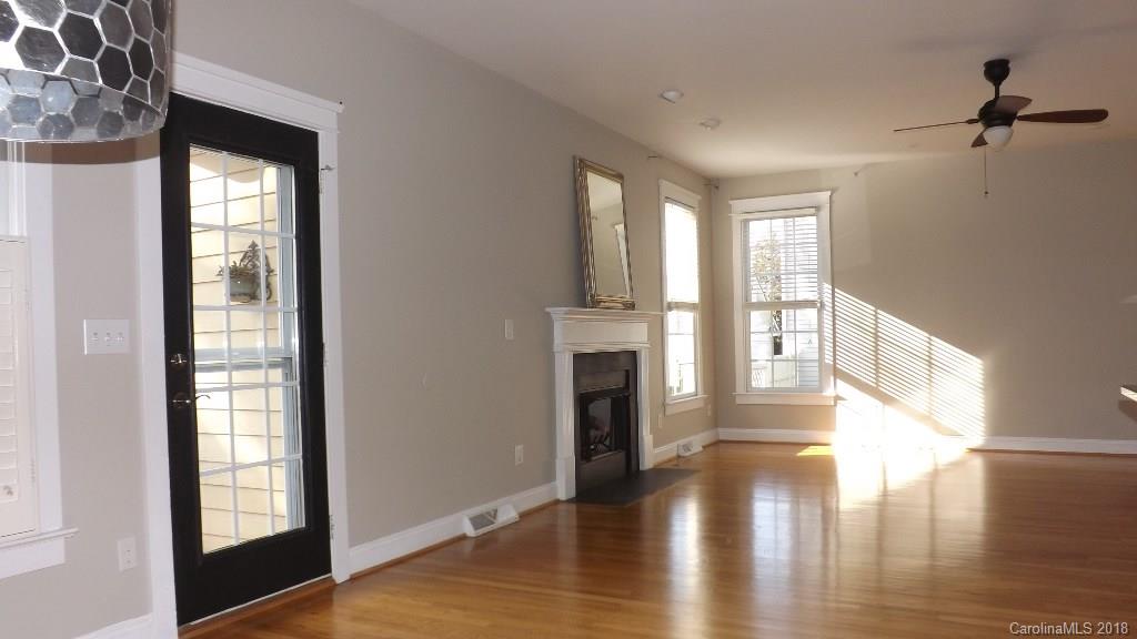 537 Glen Walk Drive Fort Mill, SC 29708 - Photo 8 of 19 a view of empty room with fireplace and wooden floor
