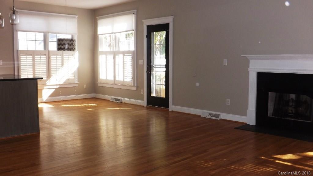 537 Glen Walk Drive Fort Mill, SC 29708 - Photo 9 of 19 a view of an empty room with wooden floor and a window