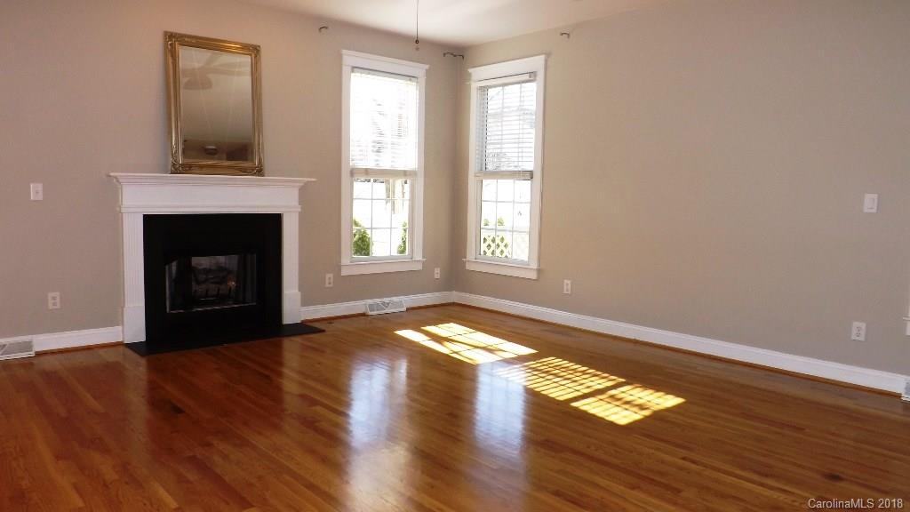 537 Glen Walk Drive Fort Mill, SC 29708 - Photo 10 of 19 a view of an empty room with wooden floor and a window