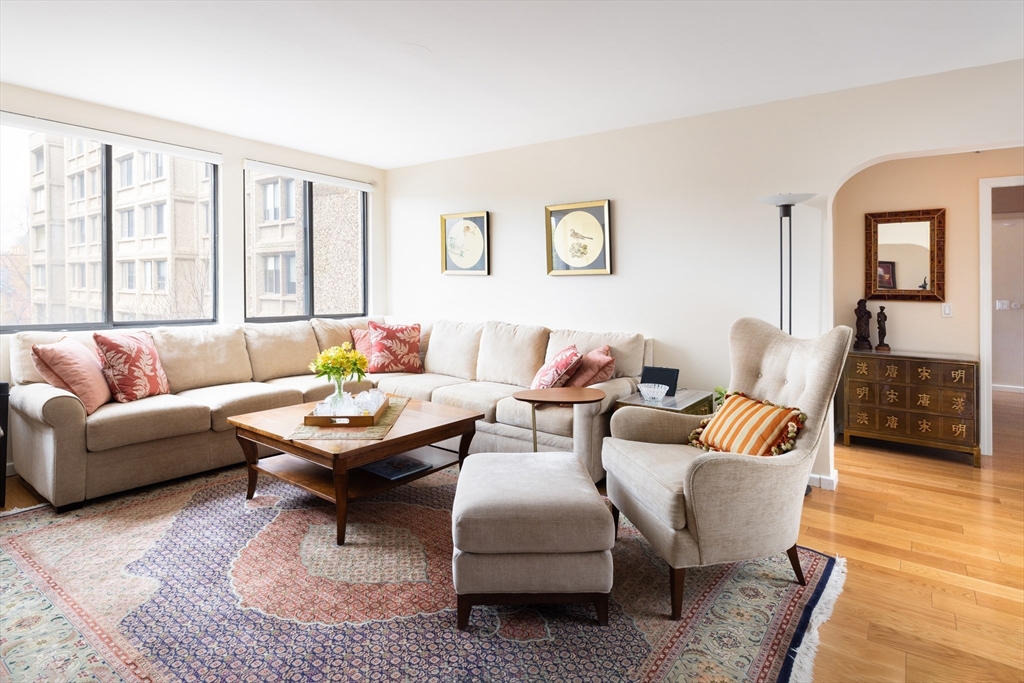 1731 Beacon Street, Unit 402 Brookline, MA 02445 - Photo 3 of 14 a living room with furniture and a large window