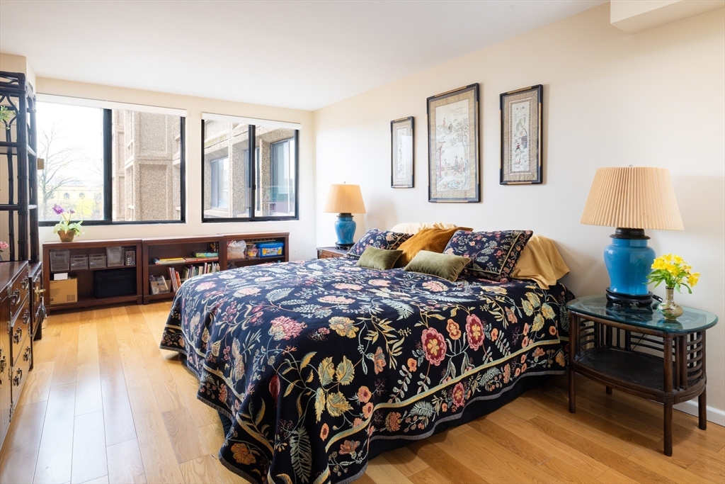 1731 Beacon Street, Unit 402 Brookline, MA 02445 - Photo 8 of 14 a bedroom with a bed and window