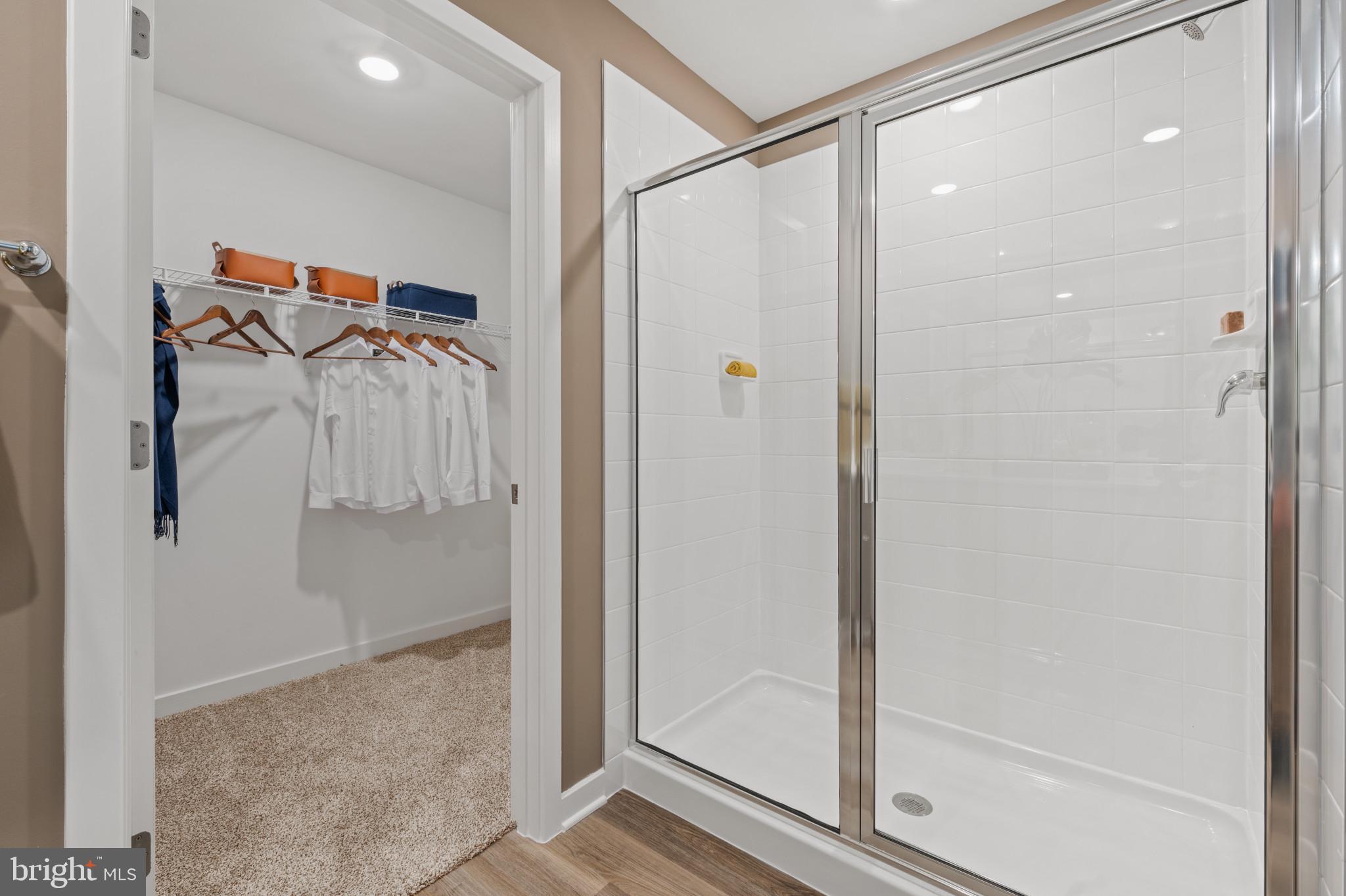 372 Eclipse Street Ranson, WV 25438 - Photo 16 of 34 a bathroom with a glass shower door and a glass door