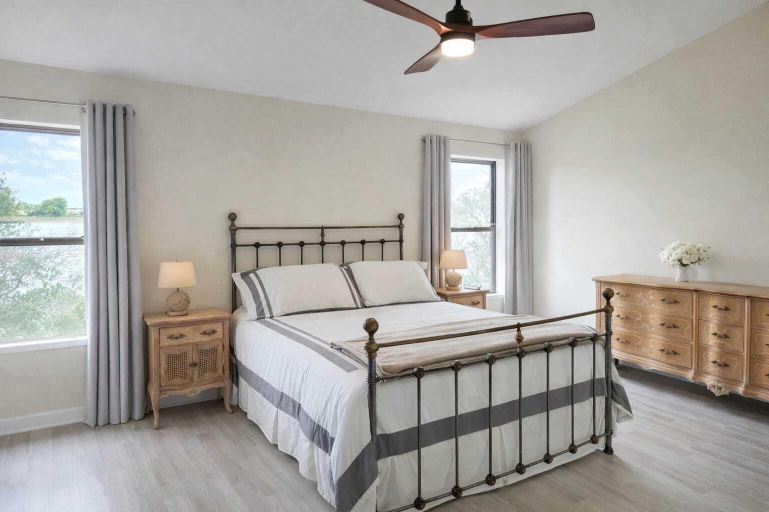 10870 Lakemore Lane, Unit 201 Boca Raton, FL 33498 - Photo 12 of 26 a bed sitting in a bedroom next to a window