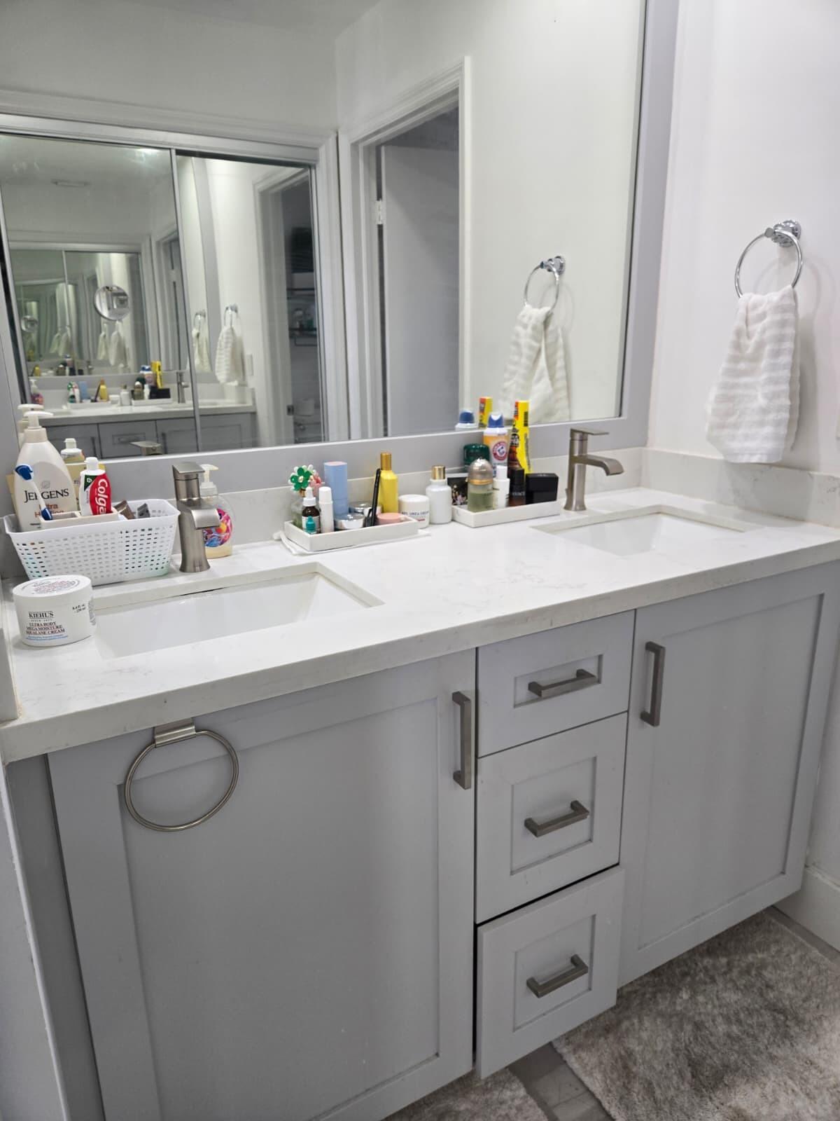 10870 Lakemore Lane, Unit 201 Boca Raton, FL 33498 - Photo 13 of 26 a bathroom with a sink double vanity and a mirror