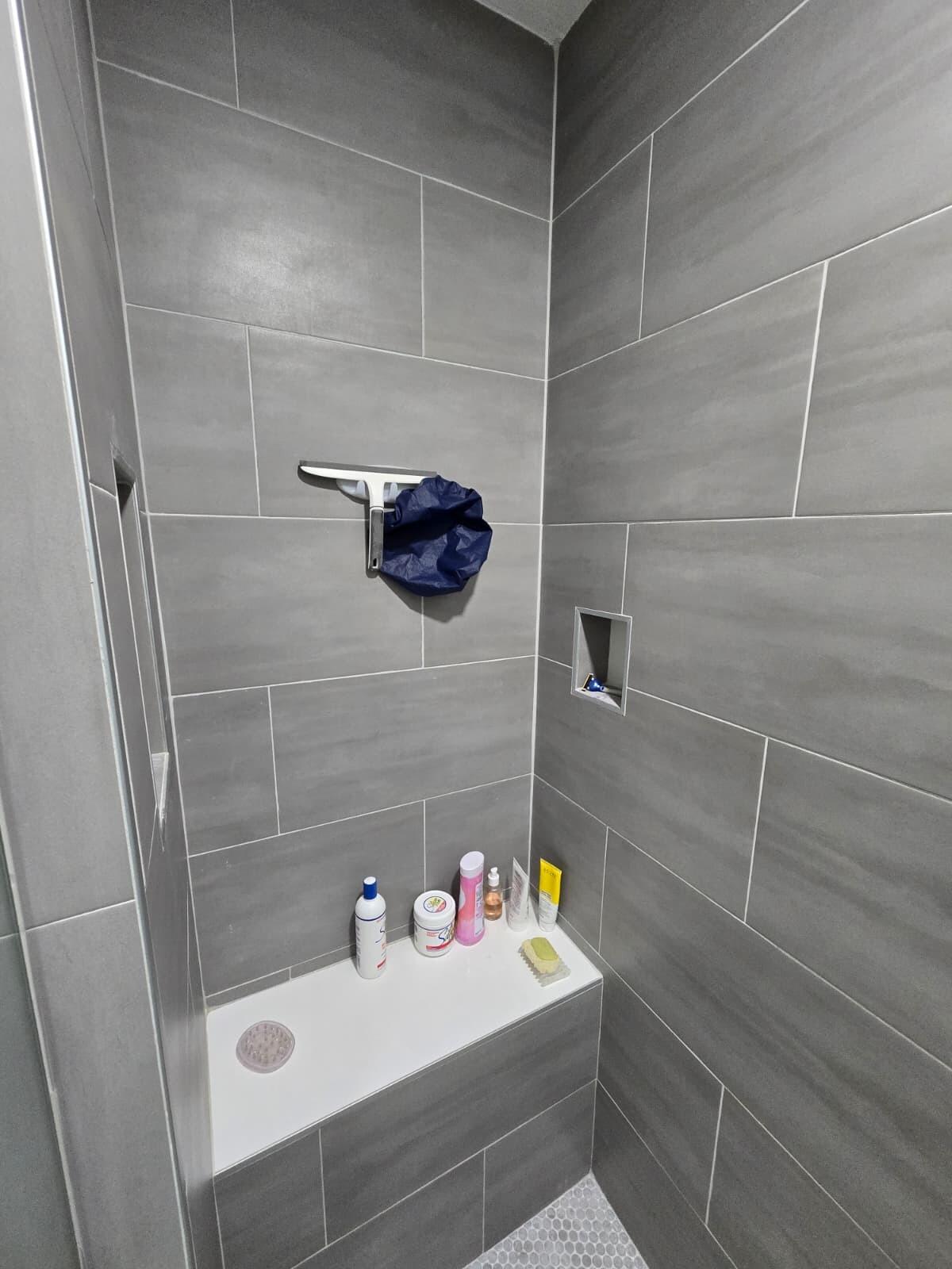 10870 Lakemore Lane, Unit 201 Boca Raton, FL 33498 - Photo 15 of 26 a bathroom with a sink and a shower