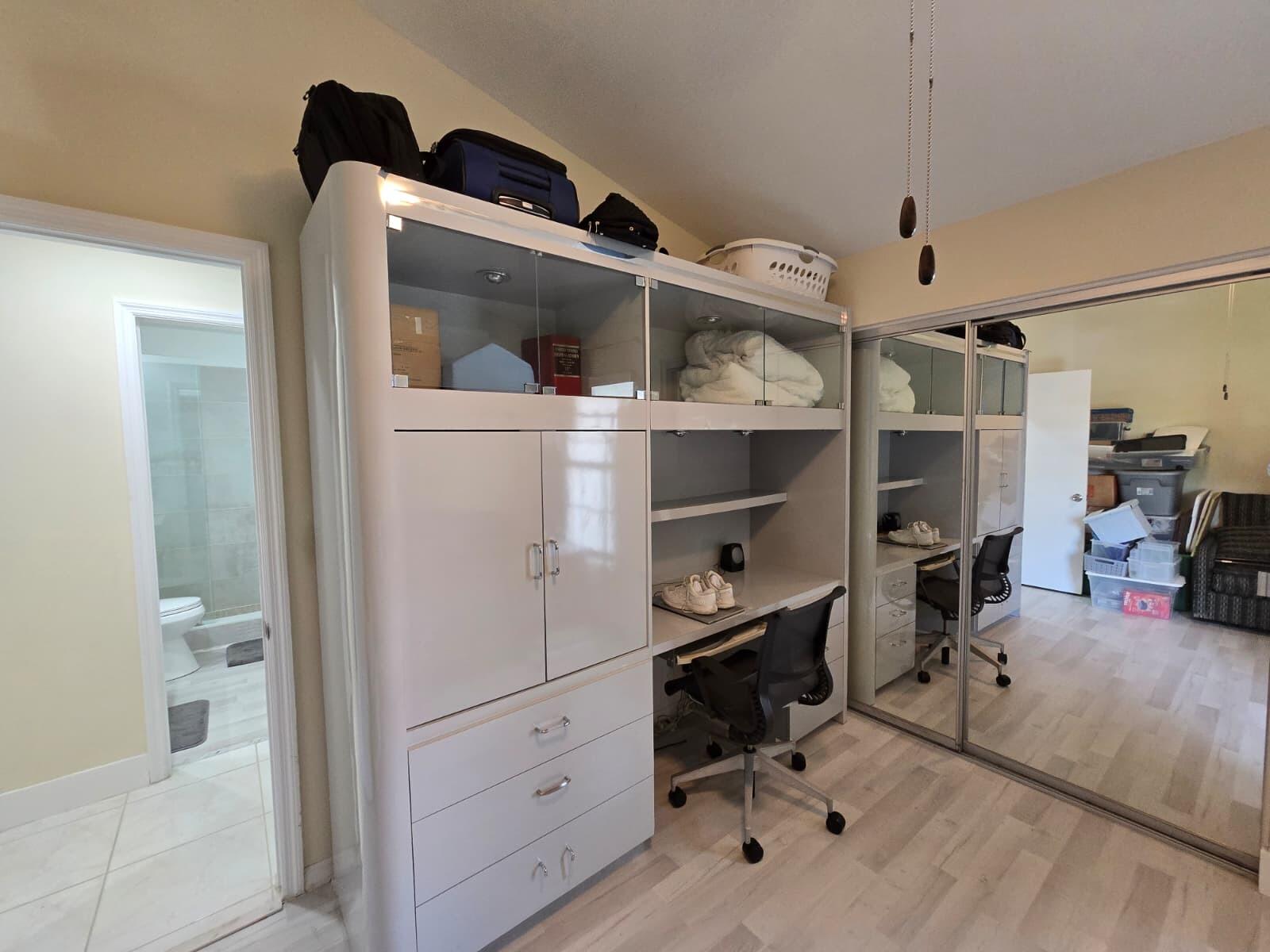 10870 Lakemore Lane, Unit 201 Boca Raton, FL 33498 - Photo 22 of 26 a view of walk in closet