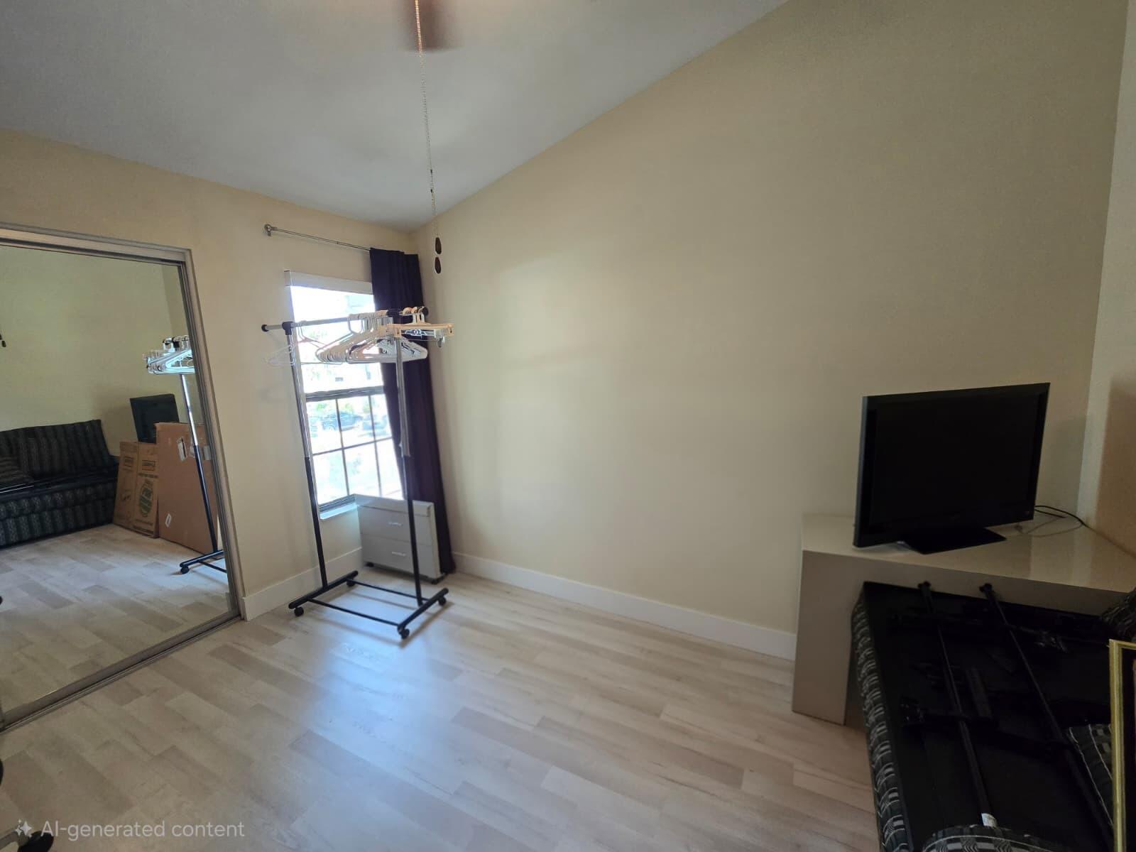 10870 Lakemore Lane, Unit 201 Boca Raton, FL 33498 - Photo 23 of 26 a view of a workspace with furniture and a window