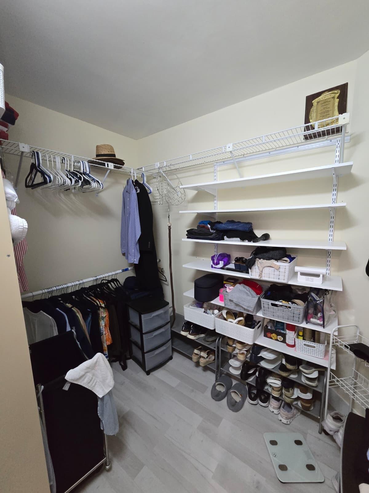 10870 Lakemore Lane, Unit 201 Boca Raton, FL 33498 - Photo 26 of 26 a view of walk in closet with clothes and shoes