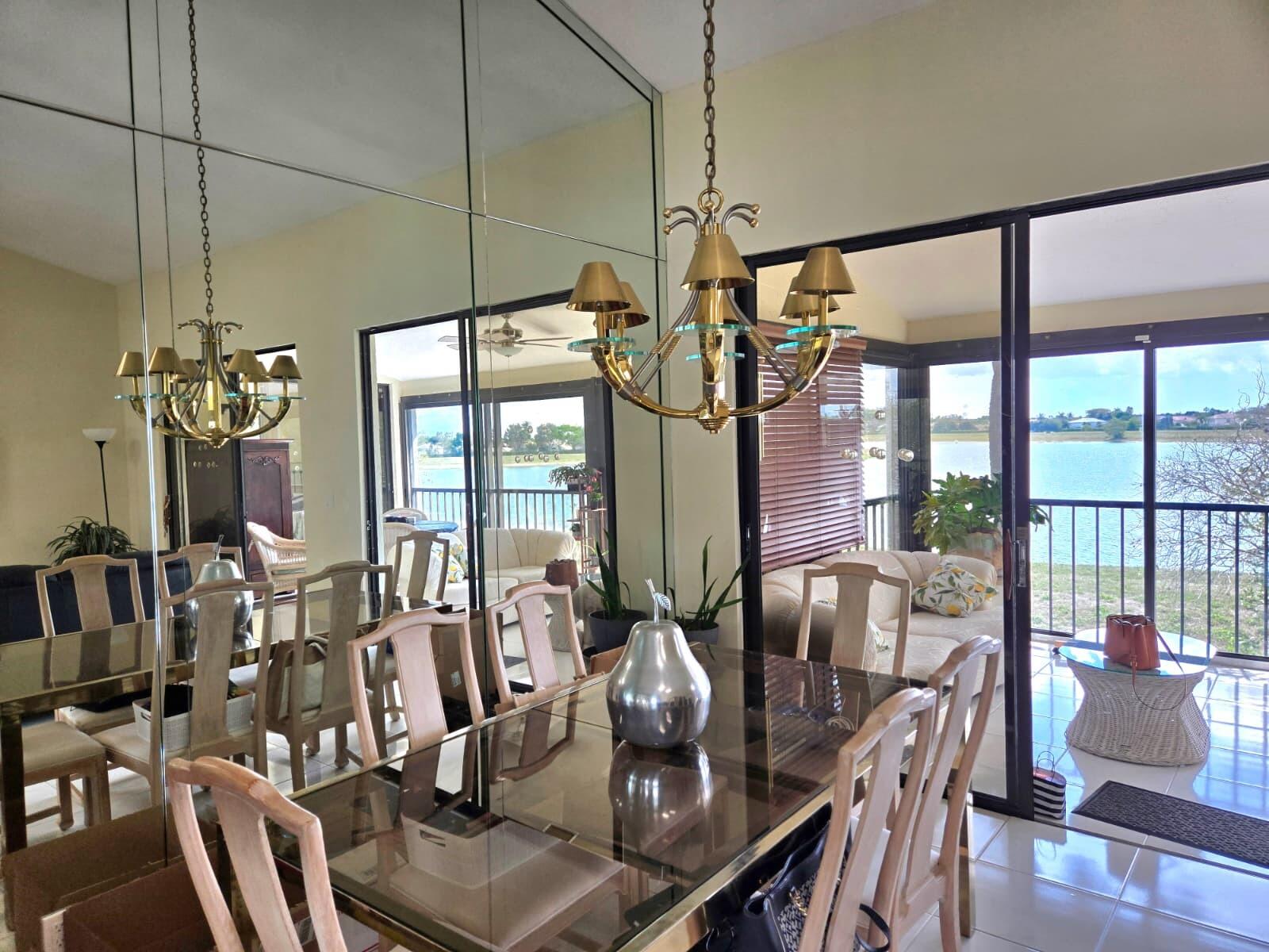 10870 Lakemore Lane, Unit 201 Boca Raton, FL 33498 - Photo 8 of 26 a view of a dining room with furniture window and outside view