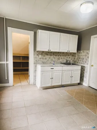 a kitchen with stainless steel appliances granite countertop a sink and cabinets