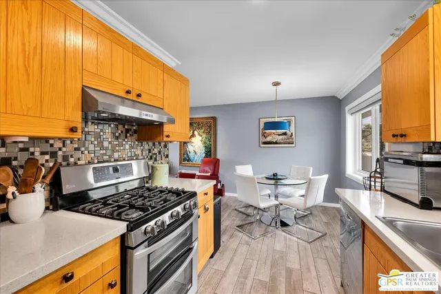 a kitchen with a stove and a microwave