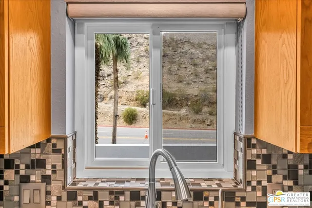 a bed room with a bed and a chair