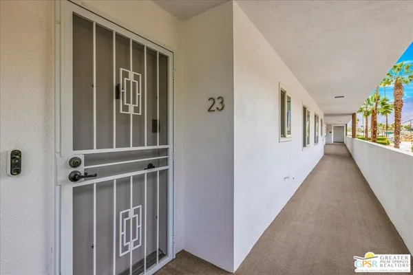 a view of an entryway with wooden floor and windows