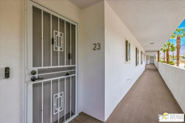 a view of an entryway with wooden floor and windows