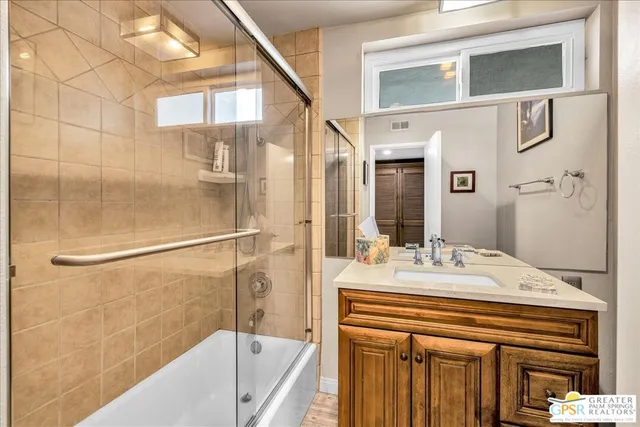 a view of a chairs and table in the balcony