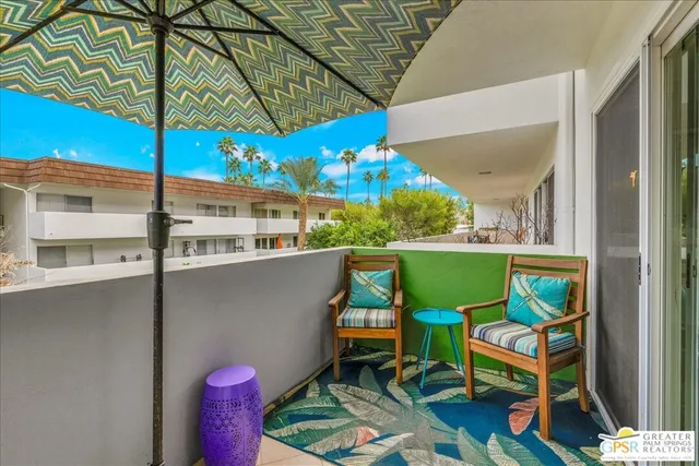 a view of balcony with furniture