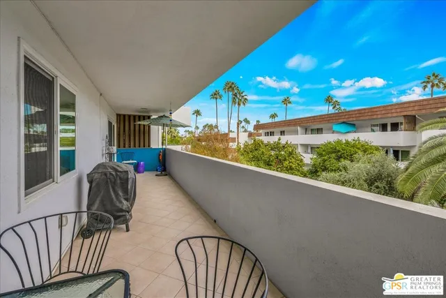 a view of balcony with furniture