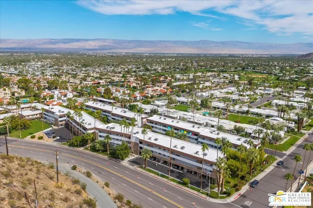 an aerial view of residential houses and city view