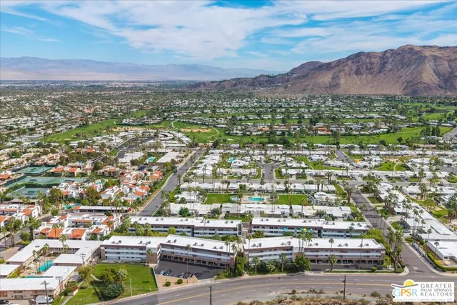 a view of a city with mountains in the background