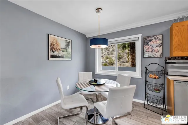 a dining room with furniture and window