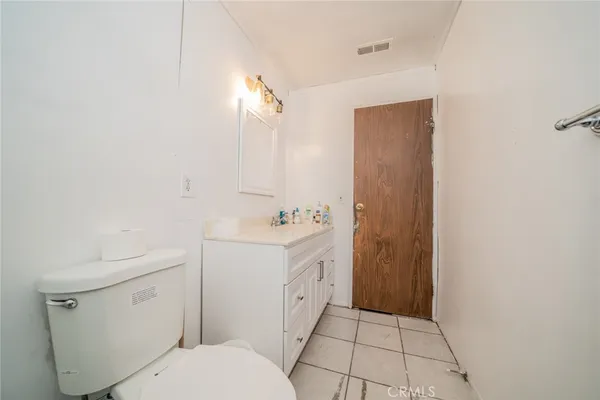 a spacious bathroom with a sink a toilet and shower