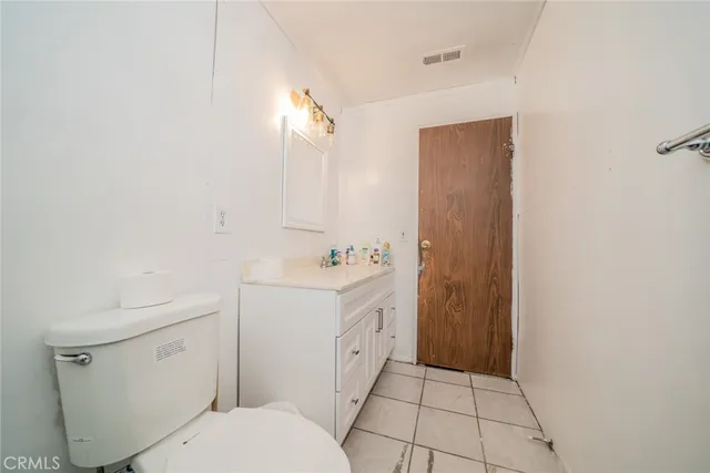 a spacious bathroom with a sink a toilet and shower