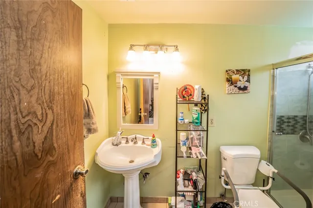 a bathroom with a sink and toilet