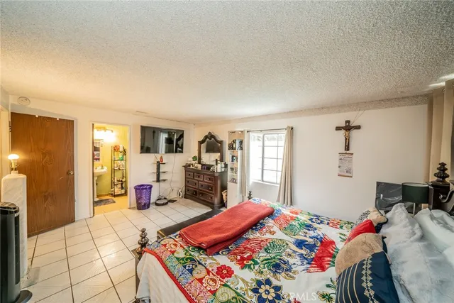 a bed room with a bed and a view of bedroom