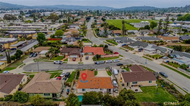 an aerial view of residential houses with outdoor space