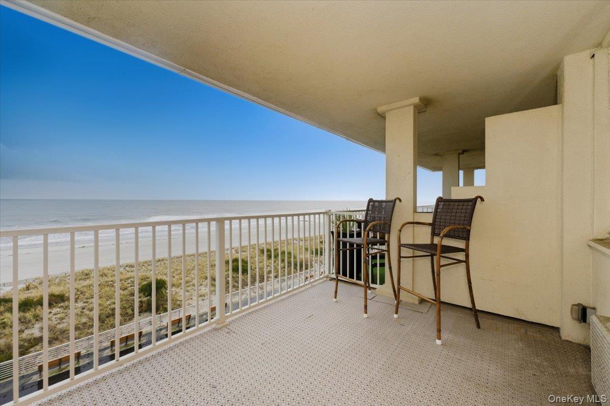 250 Shore Road, Unit 4D Long Beach, NY 11561 - Photo 2 of 16 a view of a balcony with chairs