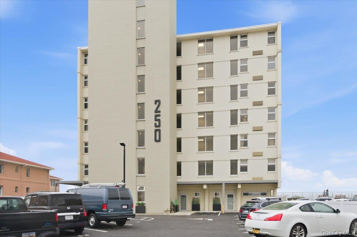 250 Shore Road, Unit 4D Long Beach, NY 11561 - Photo 3 of 16 a building with parking space
