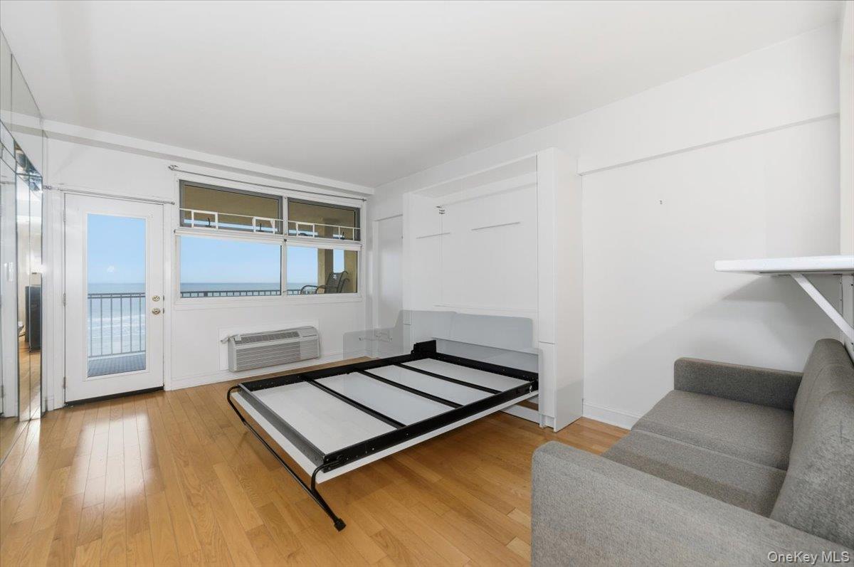 250 Shore Road, Unit 4D Long Beach, NY 11561 - Photo 7 of 16 a living room with a couch and a coffee table