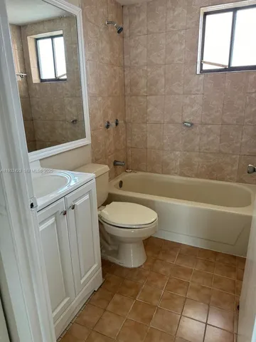 a bathroom with a toilet a sink and a bathtub