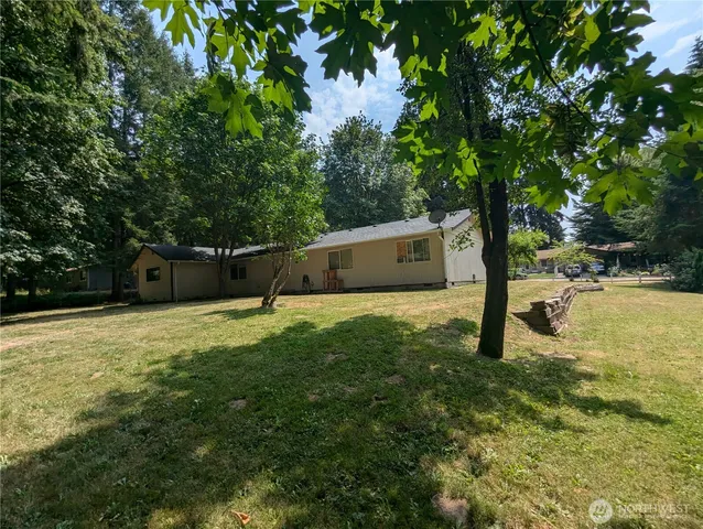 a backyard of a house with lots of green space